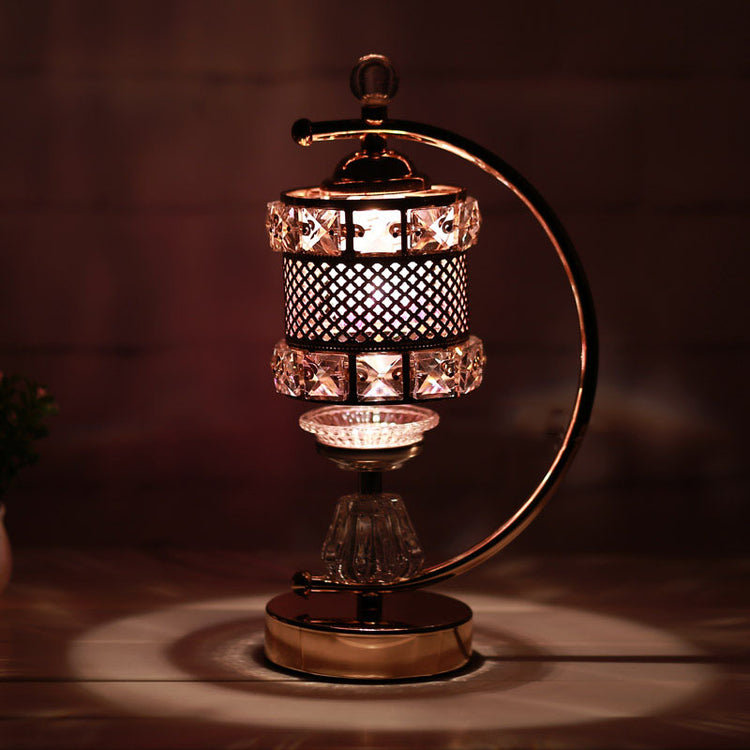 Aromatherapy lamp furnace with a stylish design, crystal accents and dimmer switch for relaxing atmosphere.