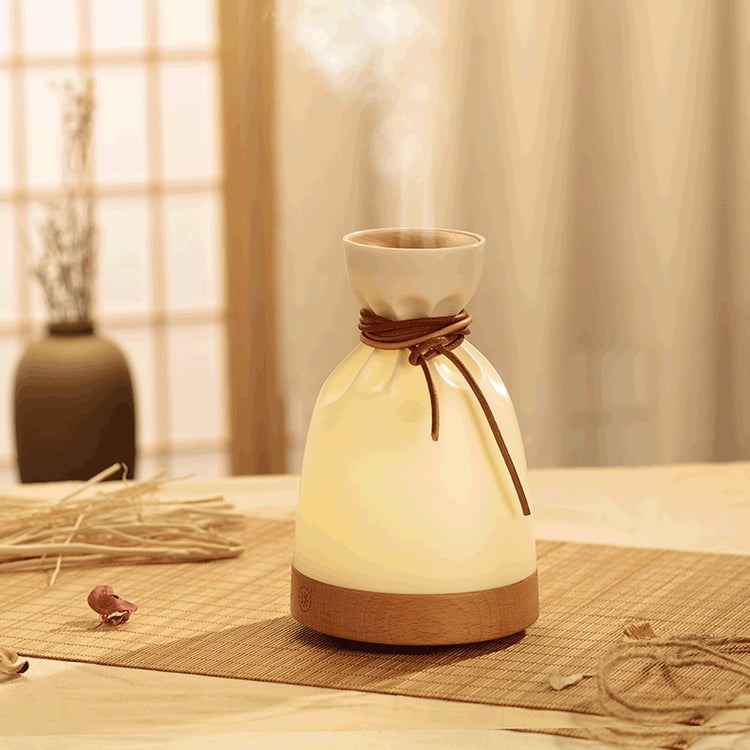 Wood Aromatherapy Desk Lamp Humidifier Aromatherapy Machine emitting mist in a serene setting with warm lighting.