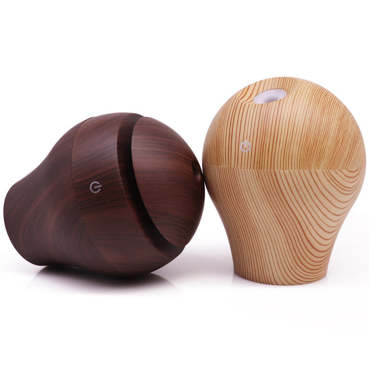 Household aromatherapy humidifier in wood texture, featuring two designs for a soothing atmosphere.